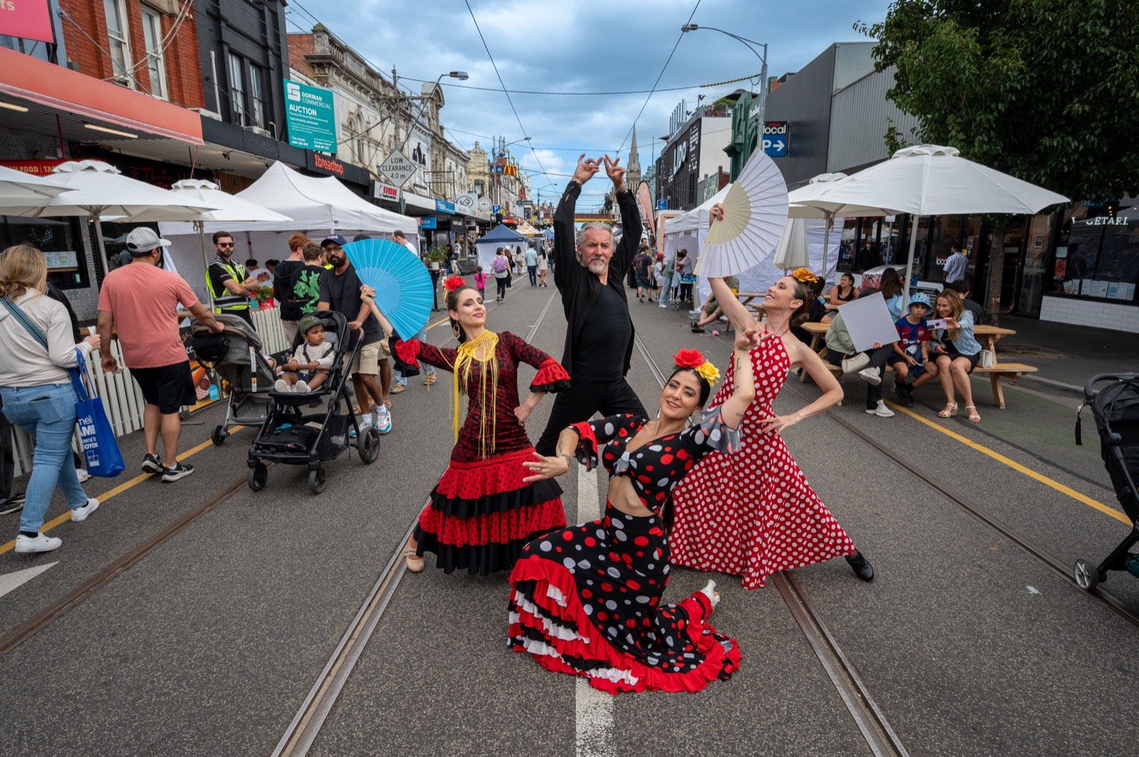 A flamenco dancer twirling in the middle of the street