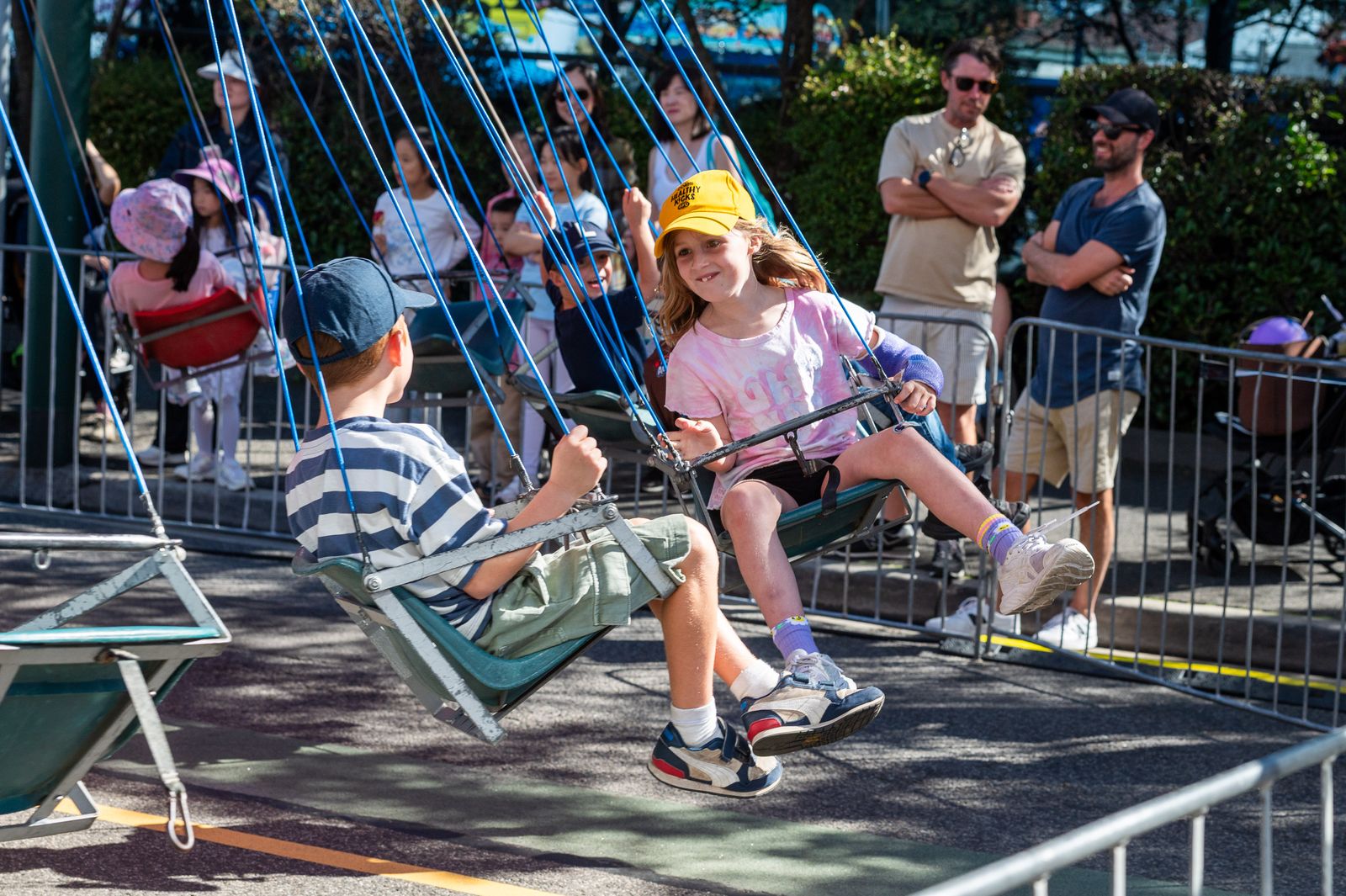 Kids enjoying the swing ride at the festival